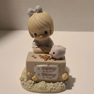 Precious Moments Figurine Girl with Piggy Bank in Cream, White, Pink